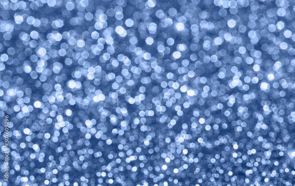 Shiny trendy blue defocused glitter background with copy space. Creative holiday and festive backdrop. Color of 2020 concept.