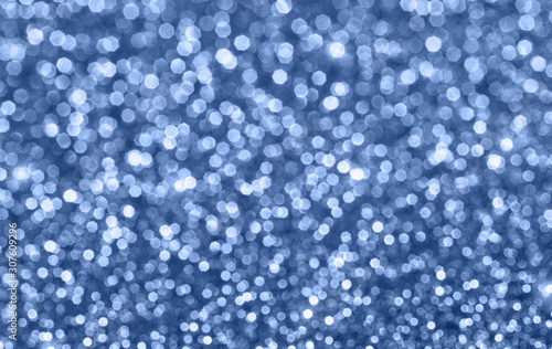 Shiny trendy blue defocused glitter background with copy space. Creative holiday and festive backdrop. Color of 2020 concept.