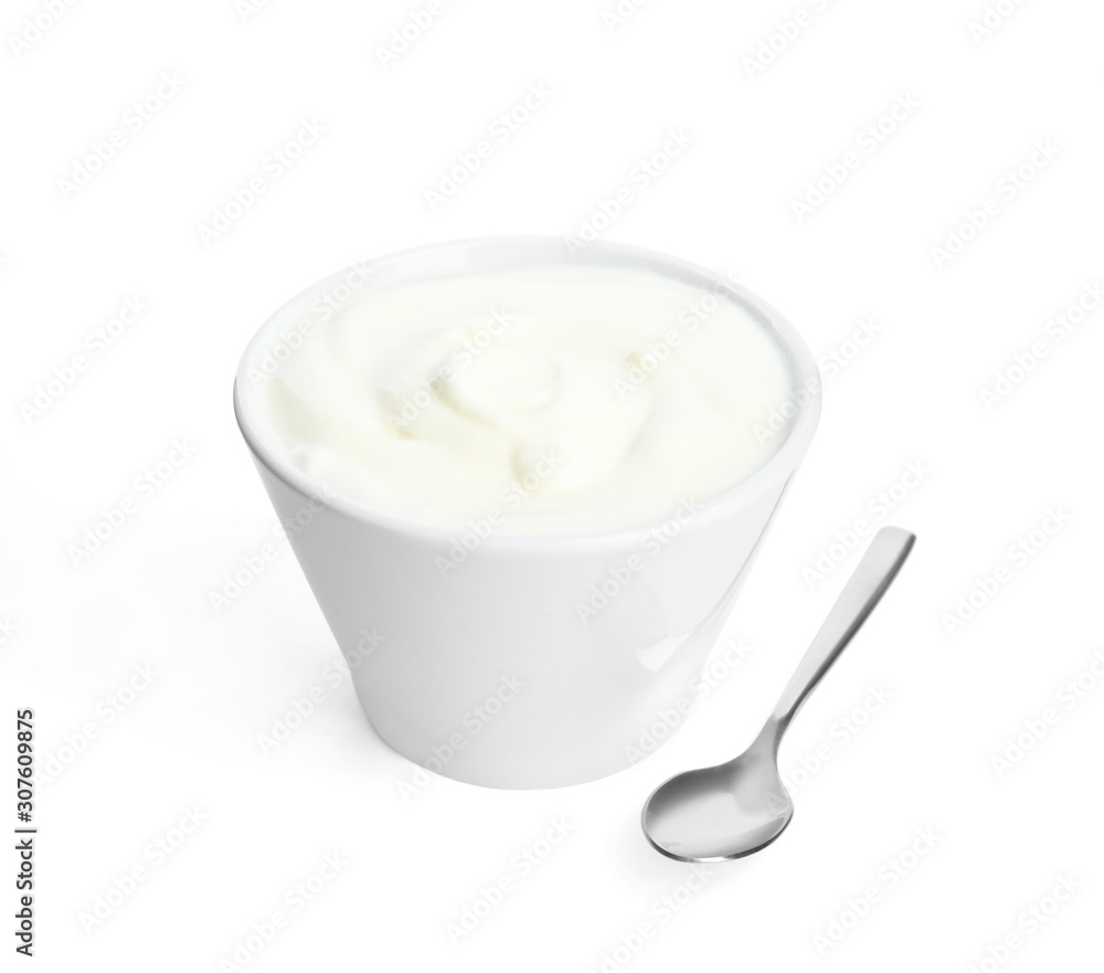 Tasty organic yogurt in bowl and spoon isolated on white Tasty organic yogurt in bowl and spoon isolated on white