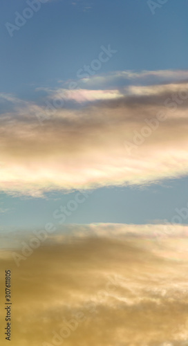 Fantastic clouds at sunrise, vertical panorama