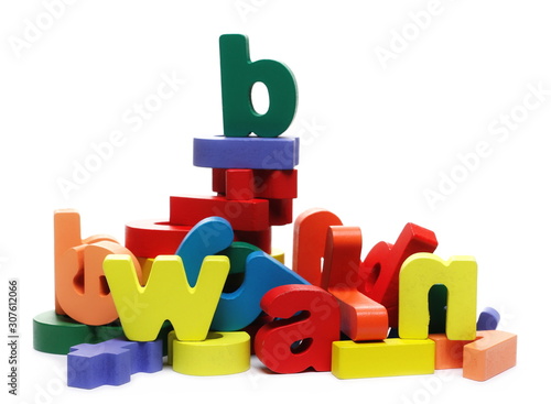 Fotografi Colorful wooden alphabet, spelling and number blocks, isolated on white backgrou