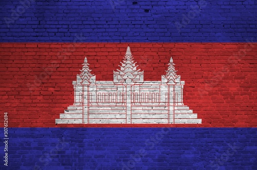 Cambodia flag depicted in paint colors on old brick wall. Textured banner on big brick wall masonry background photo