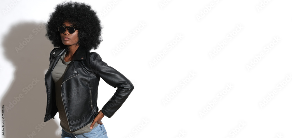 Sexy afro girl in black leather, rocky jacket and black sunglasses isolated on white background. Sexy afro girl in black leather, rocky jacket and black sunglasses isolated on white background.