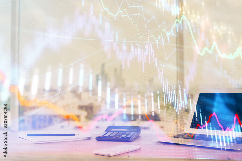 Forex graph hologram on table with computer background. Multi exposure. Concept of financial markets. Forex graph hologram on table with computer background. Multi exposure. Concept of financial markets.