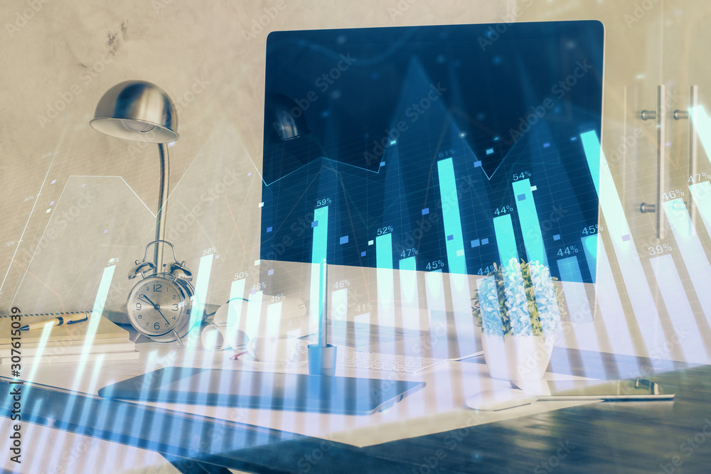 Stock market chart hologram drawn on personal computer background. Double exposure. Concept of investment. Stock market chart hologram drawn on personal computer background. Double exposure. Concept of investment.