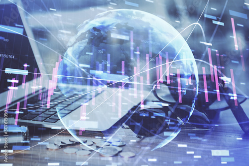 Double exposure of forex chart and work space with computer. Concept of international online trading.