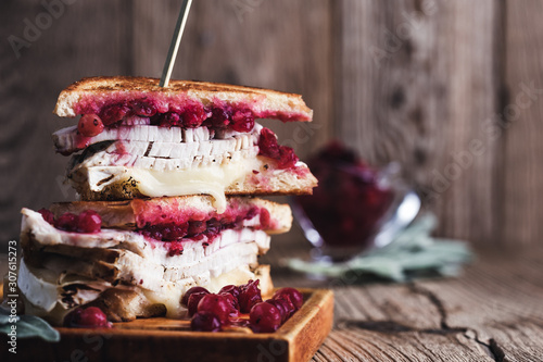 Thanksgiving turkey sandwich with brie cheese and cranberry sauce