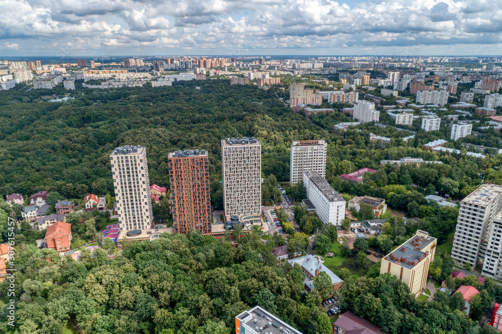 Fototapeta premium Big city, aerial view. The microdistrict of a big city, residential buildings with many high-rise buildings.