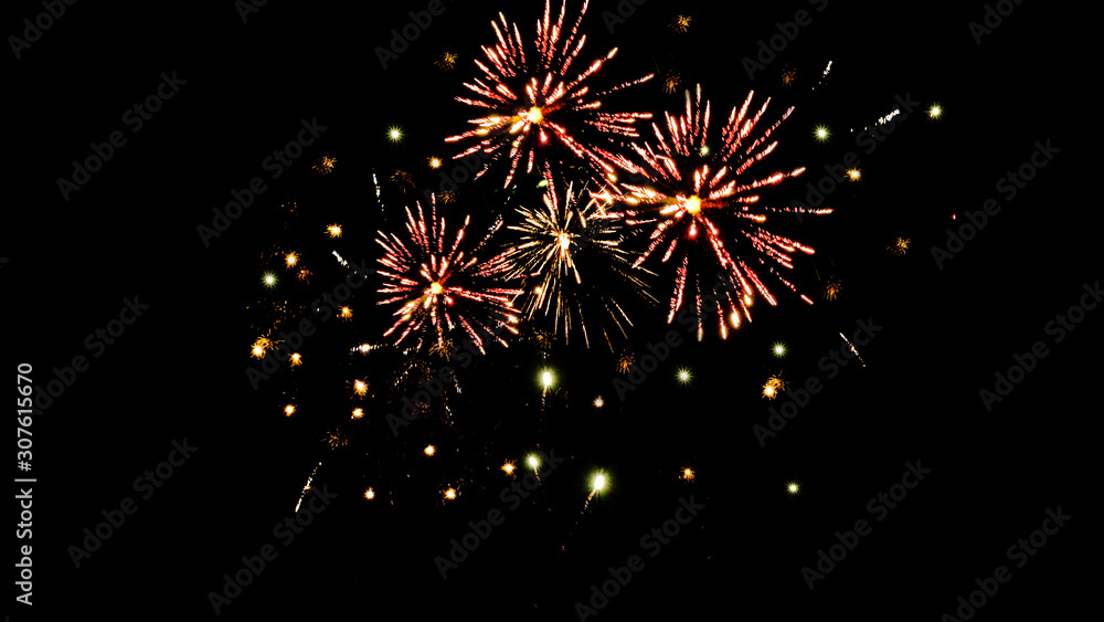 Traditional orange fireworks in dark night sky, isolated on black Traditional orange fireworks in dark night sky, isolated on black