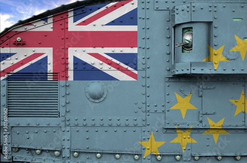 Tuvalu flag depicted on side part of military armored tank closeup. Army forces conceptual background photo