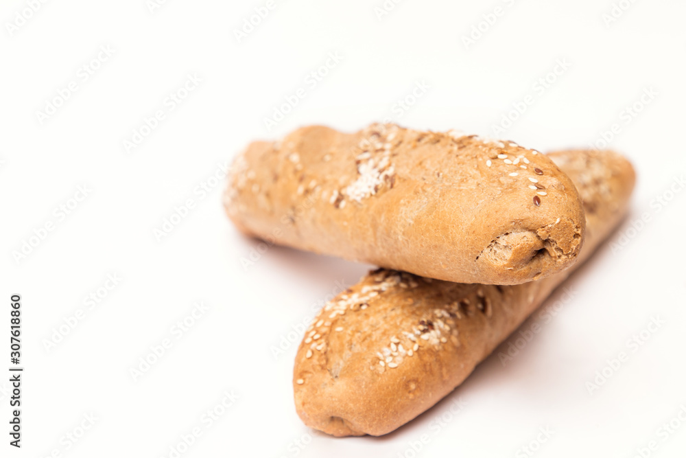two French baguette with sesame seeds on a white background two French baguette with sesame seeds on a white background