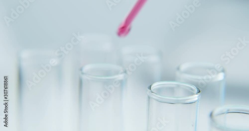 Wallpaper Mural Close-up shot with hitting laboratory equipment. Red liquid falling pipette in glass test tube. Torontodigital.ca
