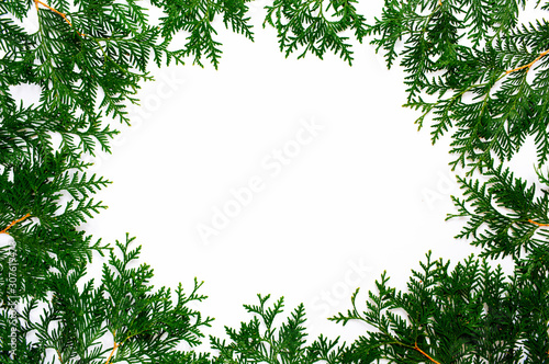 Christmas and New Year background with thuja branch, decorations and presents wrapped in craft paper with snowflakes. Flat lay, top view