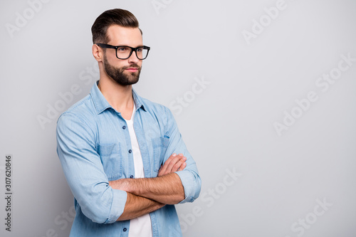 Photo of positive business guy young boss chief hands crossed self-confident person listening colleagues partners wear specs casual denim outfit isolated grey color background