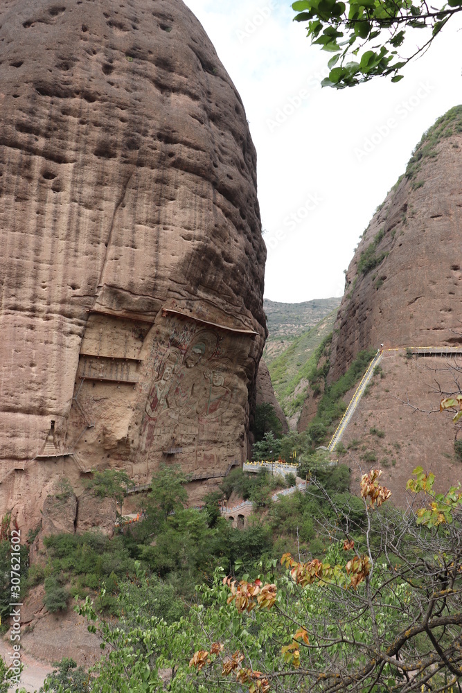 La Shao temple with giant 30-meter Buddha carved into rock at water Curtain Caves in Wushan , Gansu province, China. 