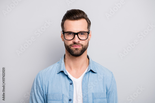 Closeup photo of amazing macho guy serious perfect appearance neat hairstyle bristle young promoted boss chief wear specs casual denim outfit isolated grey color background © deagreez