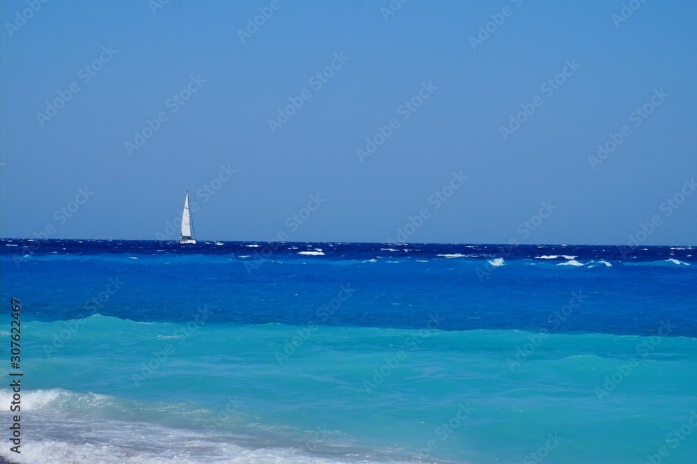 White sailboat in a beautiful sea