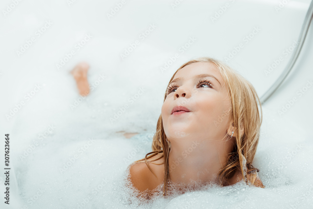 adorable naked child taking bath with bath foam at home adorable naked child taking bath with bath foam at home