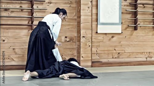 Foto Illustration Art of A Lady Aikido Martial Artists in Traditional Costume Illustrating Wrist / Hand / Arm Lock Technique to Control The Opponent