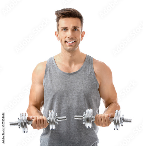 Sporty young man with dumbb...
