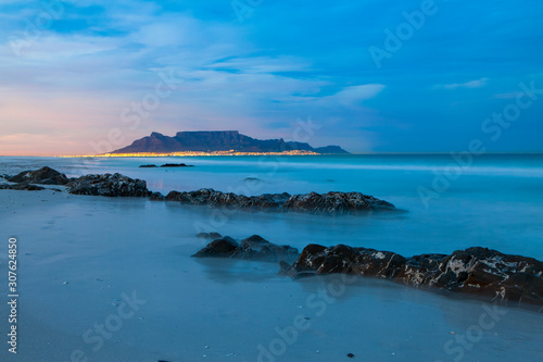 scenic view of table mountain cape town south africa from blouberg with city lights at night
