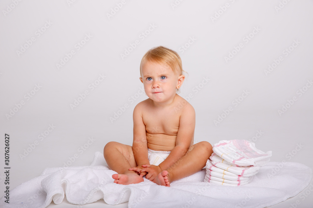 Infant baby toddler in diaper sitting crawling back happy smile on white background Infant baby toddler in diaper sitting crawling back happy smile on white background