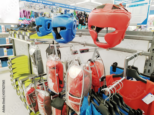 Boxing headgear and boxing gloves are sold in a large sports store