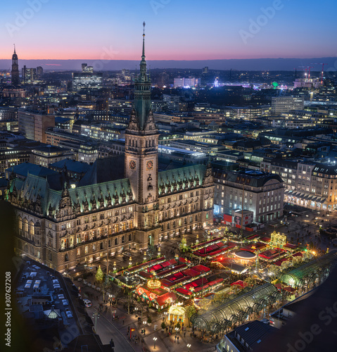 Top view of illuminated Christmas market on townhall square in advent time, Hamburg, Germany