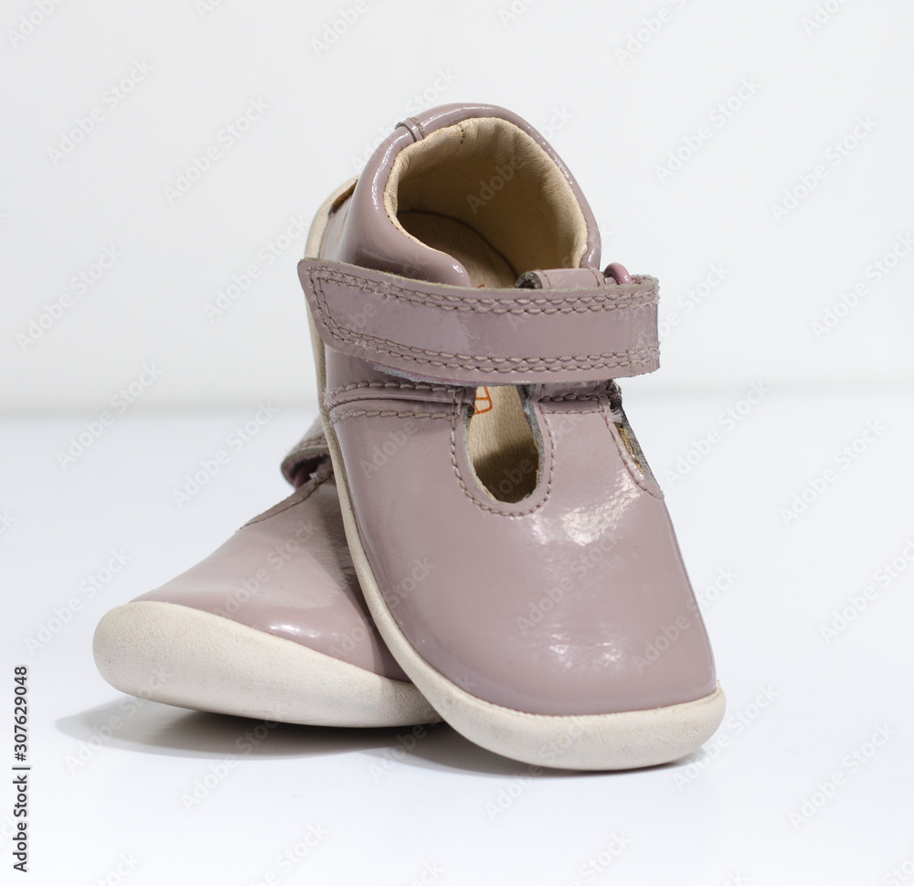 cute little vintage retro pink baby dolly shoes, isolated on a white studio  background. Tiny baby sneakers for a baby shower. Babies feet grow fast.  Stock Photo | Adobe Stock