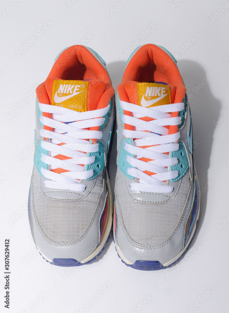 london englabnd 05 08 2018 Nike Air Max 90 Grey Clearwater Gold LIMITED EDITION. Nike air max retro classic sneaker trainers. Nike sport and street wear fashionable athletic apparel. Isolated nikes. S...