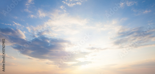 Fototapeta Naklejka Na Ścianę i Meble -  Blue sky clouds background. Beautiful landscape with clouds and orange sun on sky