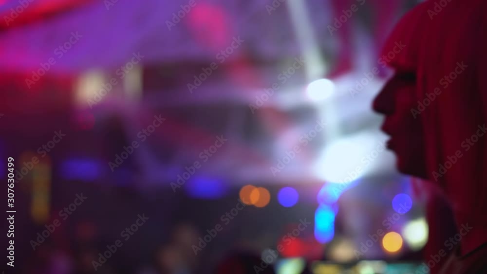 Happy young women singing and dancing at party in club, enjoying night life Happy young women singing and dancing at party in club, enjoying night life