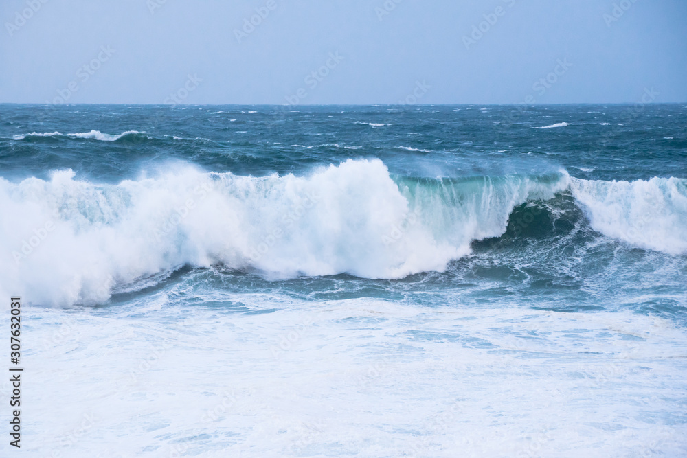 The crest of sea waves and white water on a stormy day in the Atlantic Ocean