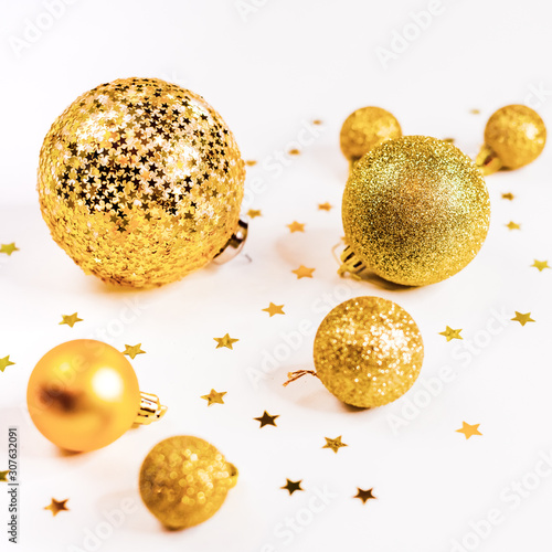Gold Christmas balls top view  on a white background  ornament  flat lay