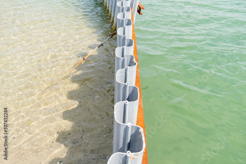 Sheet pile retaining wall on a sea shore. Recycled plastic in use. Water canal made easy. Sheet piling installed into the ground by driving or pushing. Cross-section and low weight.