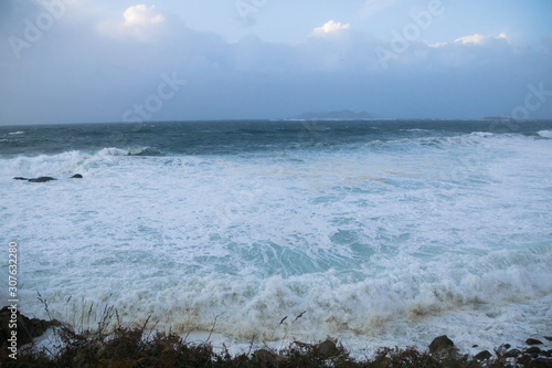 front view of the waves reaching the coast on a stormy day