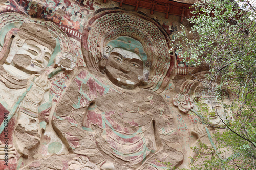 La Shao temple with giant 30-meter Buddha carved into rock at water Curtain Caves in Wushan , Gansu province, China. 