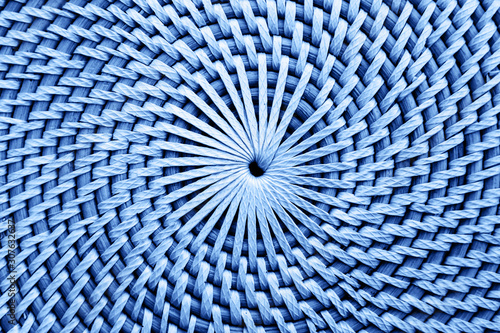 Close up view of the circular straw surface. Circular blue shapes. Textured surface with circles.
