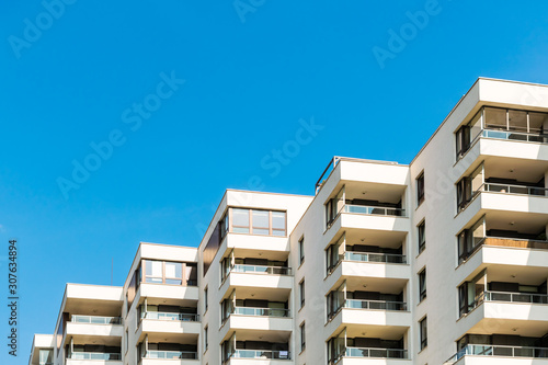 Condominium with corner balconies. Copy space above the building. © 16th