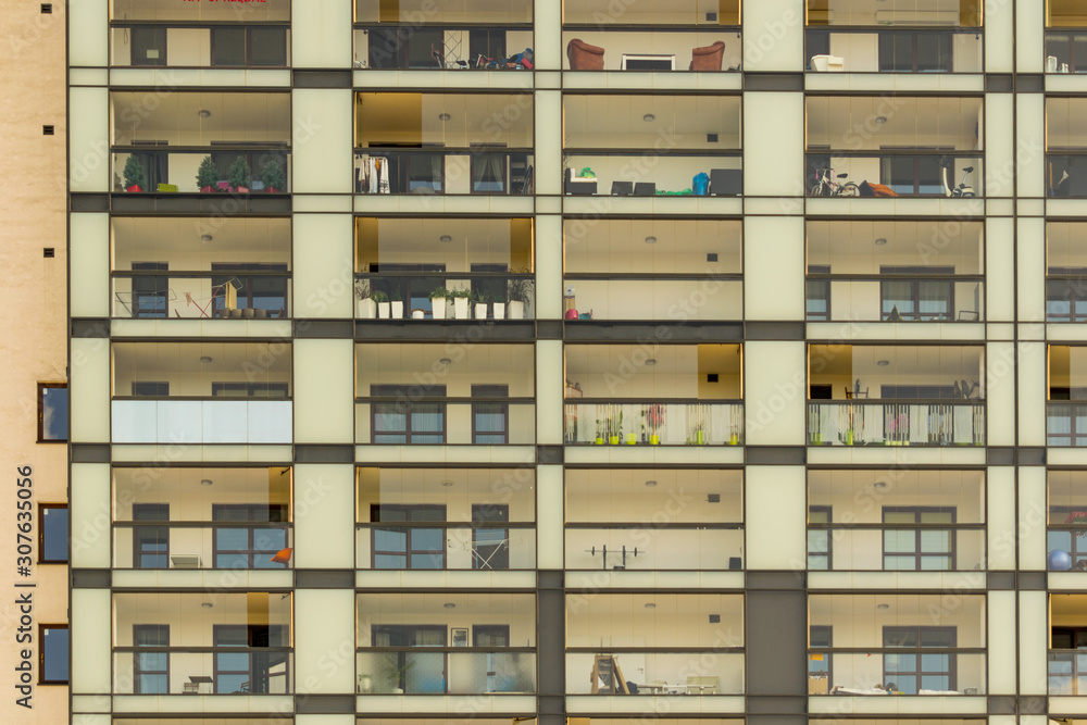 Glass balcony exterior. Condominium neighborhood. Modern block building. Glass balcony exterior. Condominium neighborhood. Modern block building.