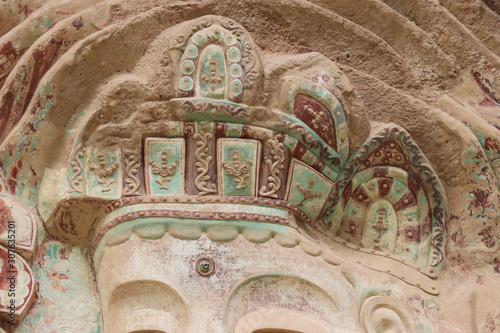 La Shao temple with giant 30-meter Buddha carved into rock at water Curtain Caves in Wushan , Gansu province, China.  photo