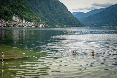 View on lake in austrian town hallstatt during tourist season in summer