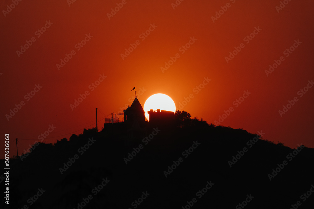 View of the sunset at the temple above the mountains at Wankaner, Gujarat, India