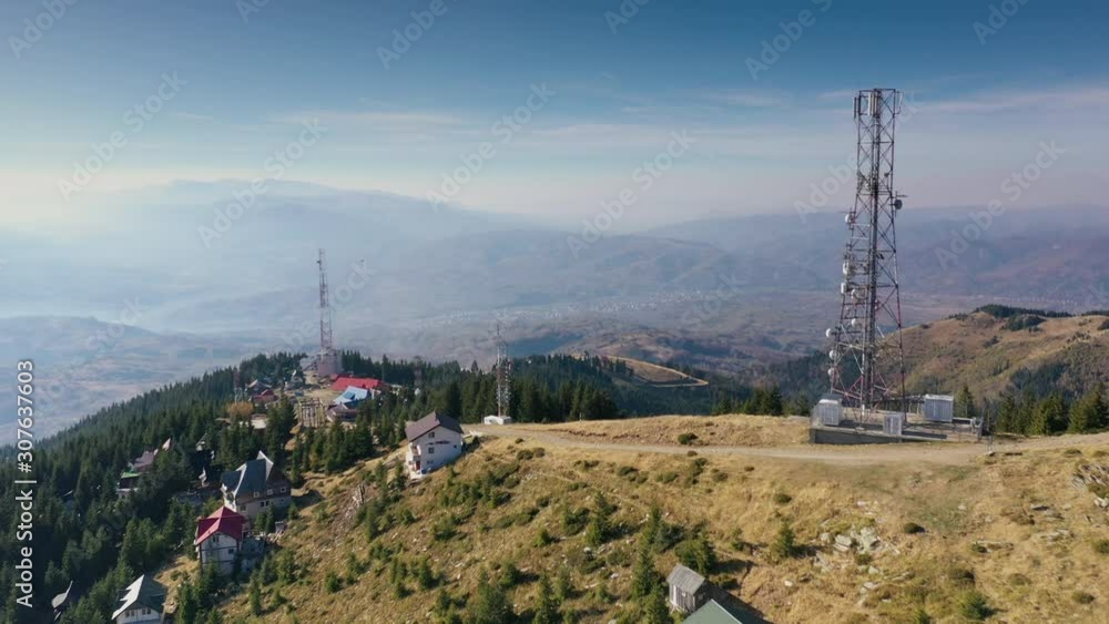 Communication transmitter tower on a hill top in the Parang Mountains Communication transmitter tower on a hill top in the Parang Mountains