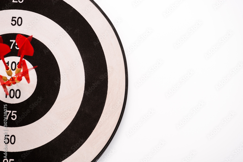 top view of black and white dartboard with red arrows isolated on white