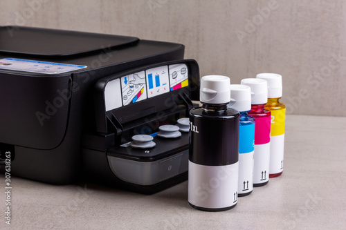 inkjet four-color printer with continuous ink supply and ink bottles for refilling photo