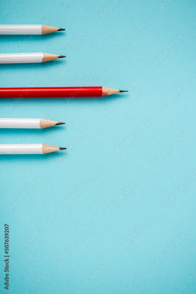 top view of sharpened white and red pencils isolated on blue top view of sharpened white and red pencils isolated on blue