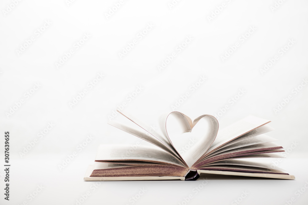 book with heart-shaped pages on white book with heart-shaped pages on white
