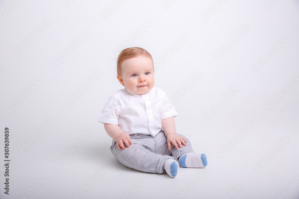 baby boy sitting on a white background. portrait of a child isolated on white background baby boy sitting on a white background. portrait of a child isolated on white background