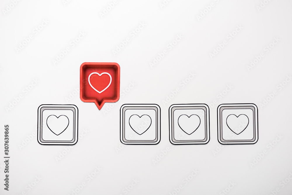 top view of red speech bubble with heart near black cubes isolated on white